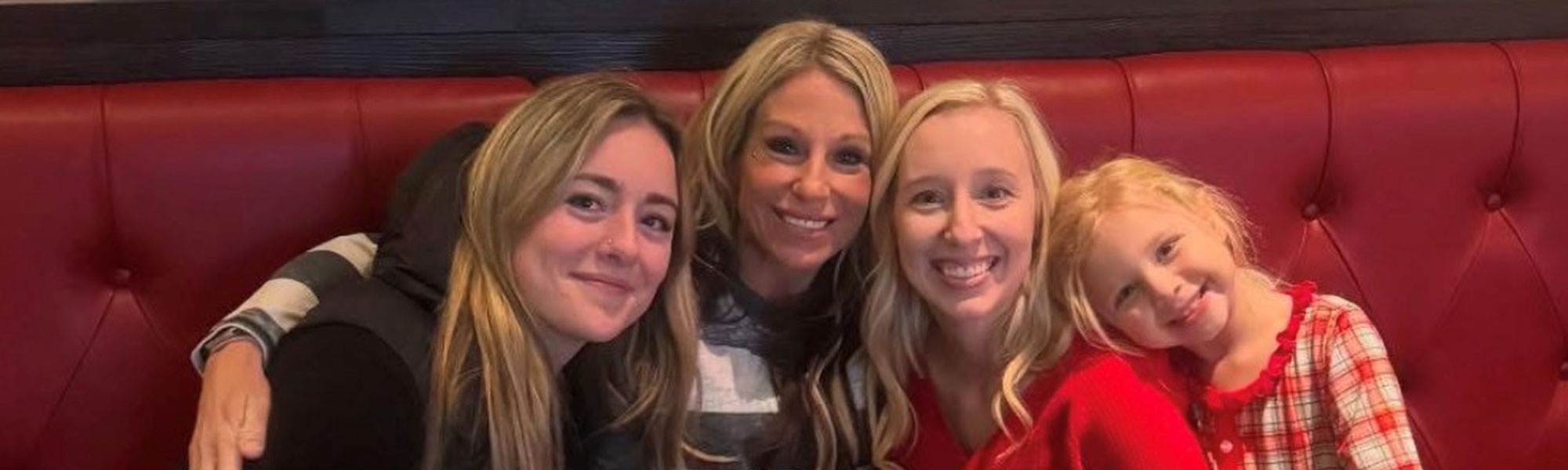 Family Sitting At Booth