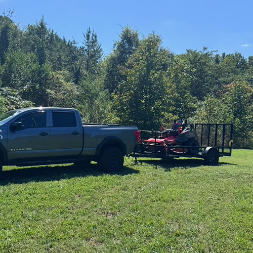 Truck Pulling Lawn Mower