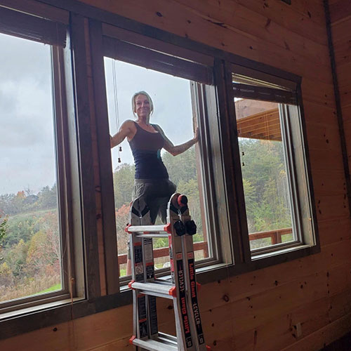 Woman Cleaning Window